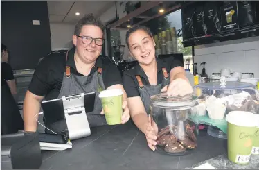  ??  ?? OPEN FOR BUSINESS: Jo Ellis, left, and Sasha Kurtze are ready to serve customers from new take-away cafe Una Sosta ice creamery near May Park. Picture: PAUL CARRACHER