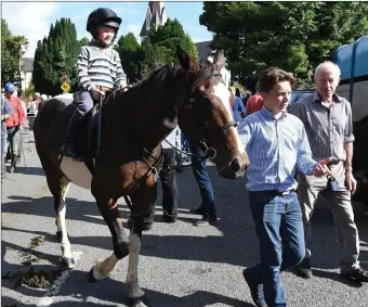  ?? Photo by Michelle Cooper Galvin ?? Dylan O’Connor and Connie O’Donoghue with their horse for sale at the Annual 15th August Fair Day in Kenmare on Monday.