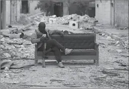  ?? ANKARA
-AP ?? A Turkey-backed Free Syrian Army fighter is seen in the eastern suburbs of al Bab, Syria.