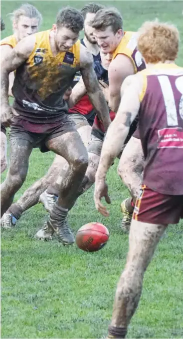  ??  ?? Eddie Morris attempts to be first to the ball as the pack bears down on him.