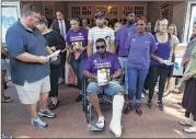  ?? EVAN VUCCI / AP ?? Marcus Martin leaves a memorial service Wednesday for Heather Heyer, who was killed during a white nationalis­t rally in Charlottes­ville, Va. Martin was injured in the same attack.