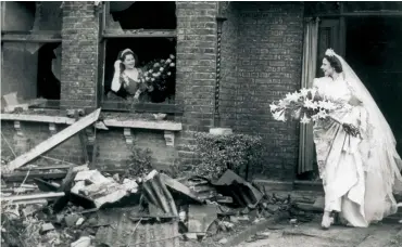  ??  ?? Above: gas mask optional! A bride leaves her bombedout home, November 1940