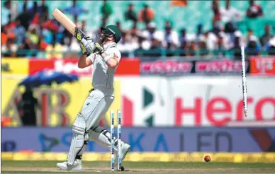  ?? ADNAN ABIDI /REUTERS ?? Australia captain Steven Smith is clean bowled by India’s Bhuvneshwa­r Kumar during Monday’s fourth Test match in Dharamsala, India. The host won by eight wickets on Tuesday and clinched the four-match series 2-1.