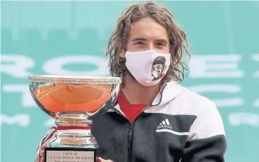  ?? AFP ?? Stefanos Tsitsipas celebrates with the trophy after winning the Monte Carlo Open on Sunday.