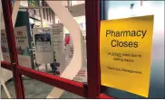  ?? AP PHOTO/TOM MURPHY ?? A “pharmacy closes” sign citing staffing shortages is posted outside a CVS pharmacy Thursday in Indianapol­is.