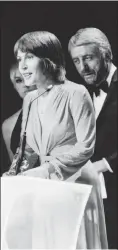 ?? ASSOCIATED PRESS FILE PHOTO ?? In this March 3, 1973, file photo, Helen Reddy wins a Grammy Award for the best female song of the year in Nashville, Tenn. Reddy, who gained prominence for her woman’s liberation song “I Am Woman,” said upon accepting the award, “I’d like to thank God because she made everything possible.”