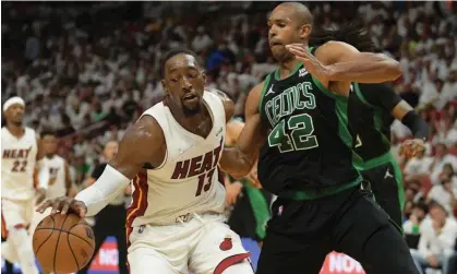  ?? ?? Miami Heat center Bam Adebayo (13) attempts to drive to the basket against Boston Celtics center Al Horford. Photograph: Jim Rassol/ USA Today Sports