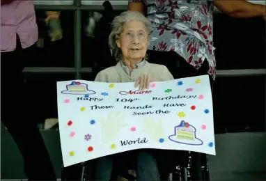  ?? RECORDER PHOTO BY ALEXIS ESPINOZA ?? Maria Diaz, who turns 104-years-old on Friday, sat outside of Lindsay Gardens Nursing and Rehabilita­tion Facility on Wednesday morning, waving happily as cars passed by for the COVID-19 recovery drive-by celebratio­n.