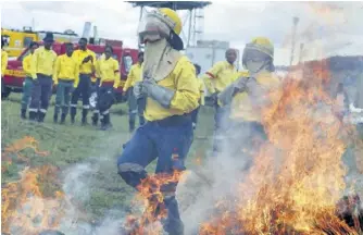  ??  ?? Fire and rescue teams simulate putting out a fire at the launch of the Provincial Summer Disater Awareness campaign