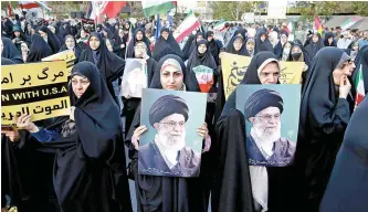  ?? EPA-Yonhap ?? Iranians take part in a celebratio­n following Iran’s attack on Israel at Palestine Square in Tehran, Monday.