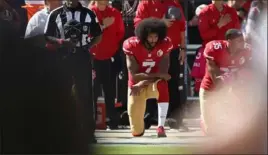  ?? Ezra Shaw/Getty Images ?? Colin Kaepernick, then a member of the San Francisco 49ers, kneels for the national anthem on Oct. 23, 2016, before a game at Levi’s Stadium in Santa Clara, Calif.