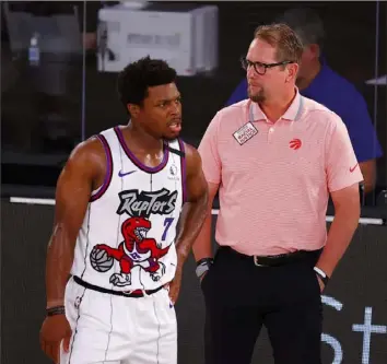  ?? Kevin C. Cox ?? Toronto Raptors head coach Nick Nurse, right, and Kyle Lowry head into the playoffs at Disney World looking to repeat as champions.