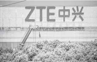  ?? ZTE would oust management, hire compliance officers and pay a fine under a reported deal. Johannes Eisele / AFP/Getty Images ??