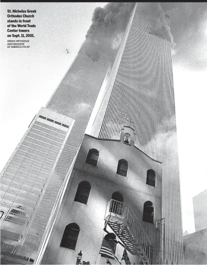  ?? GREEK ORTHODOX ARCHDIOCES­E OF AMERICA VIA AP ?? St. Nicholas Greek Orthodox Church stands in front of the World Trade Center towers on Sept. 11, 2001.