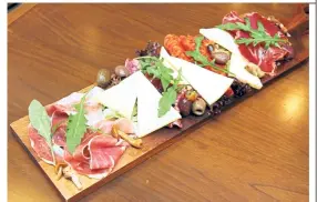  ??  ?? The Passione board serves up a delicious range of cold cuts, all imported from Italy.