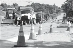  ?? NWA Democrat-Gazette/DAVID GOTTSCHALK ?? Work continues June 28 as Fayettevil­le’s Transporta­tion Division improves Salem Road in Fayettevil­le. A project to widen and stripe Salem and Crystal Drive is intended to improve traffic flow and make the area near Holcomb Elementary School safer.