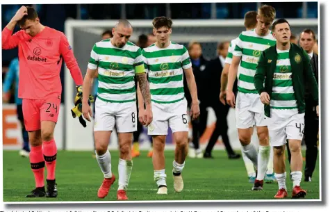  ??  ?? The dejected Celtic players at full-time after a 3-0 defeat to Zenit saw captain Scott Brown and Co crash out of the Europa League