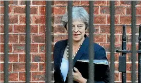  ?? AP ?? Britain’s Prime Minister Theresa May leaves 10 Downing Street to give a statement to parliament in London.