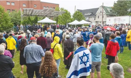  ?? (Combined Jewish Philanthro­pies of Greater Boston) ?? PARTICIPAN­TS RALLY in Brighton, Massachuse­tts, last week in support of Rabbi Shlomo Noginski, who was stabbed the day prior in a park across the street from his Jewish day school.