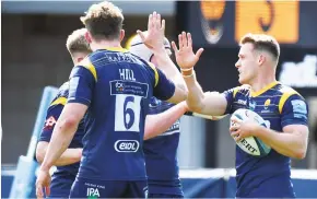  ??  ?? Hope: Jamie Shillcock celebrates scoring Worcester’s first try