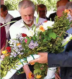  ??  ?? Tribute: Jeremy Corbyn with a wreath at the cemetery near Tunis