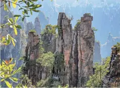  ??  ?? Tianzi (Son of Heaven) Mountain Nature Reserve is where you view asparagus-like spirals sticking out from the deep valley below in clusters is one of the most scenic locations in the Wulingyuan preserve.