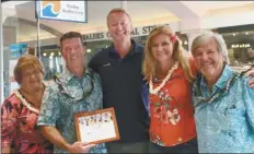  ??  ?? Basketball­MAUI founder Ben Prangnell (center) poses with RAM members (from left) Lydia Pedro, Brad MacArthur, Alana Rucynski and Tom Tezak of Wailea Realty Corp. A Boutique of Windermere Real Estate, sponsor of the third annual Maui Jim Maui Classic tournament.