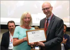  ??  ?? Macroom native Dr Margaret Linehan receiving the award of Companion of the British Academy of Management from Prof Nic Beech, chair of the British Academy of Management.