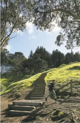  ?? Photos by Liz Hafalia / The Chronicle ?? Steps lead up to Beacon Street on Billy Goat Hill, above, which also features a concrete bench for taking in the splendor of unspoiled San Francisco, below.