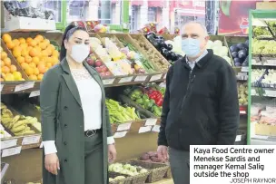 ?? JOSEPH RAYNOR ?? Kaya Food Centre owner Menekse Sardis and manager Kemal Salig outside the shop