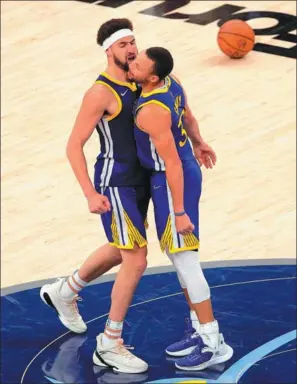  ?? AP ?? Golden State Warriors’ Klay Thomspon (left) and Stephen Curry celebrate after defeating the Memphis Grizzlies in Game 1 of their NBA playoff second-round series on Sunday.