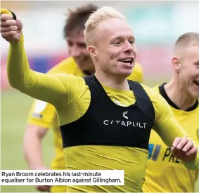  ??  ?? Ryan Broom celebrates his last-minute equaliser for Burton Albion against Gillingham.