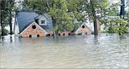  ?? DAVID J. PHILLIP/AP ?? A $29 billion disaster aid request includes $16 billion to shore up the government-backed flood insurance program. The program’s critics might balk at funding it without changes.