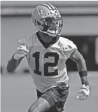  ?? GERALD HERBERT/AP ?? Saints wide receiver Chris Olave works out during rookie minicamp on Saturday.