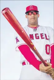  ?? Rob Tringali Getty Images ?? YUNEL ESCOBAR, who switched to a bigger bat in 2013, wields a 36-inch, 34-ounce model, a relic of an earlier era marveled at by teammates and foes alike.