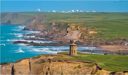  ?? MIKE HAYWARD ?? The old coastguard lookout Compass Point, with GCHQ Bude seen in the distance, on the north Cornish coast.