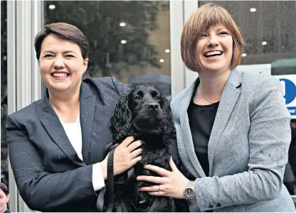  ??  ?? Mum’s the word: Ruth Davidson, the leader of the Scottish Conservati­ves, poses with Jen Wilson, her partner, right. Below, Melanie Rickey, with Mary Portas, left, who she married in 2010