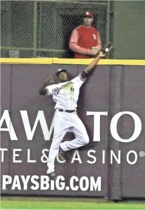  ?? RICK WOOD / MILWAUKEE JOURNAL SENTINEL ?? After he makes spectacula­r plays, Lorenzo Cain takes care of his young family at home.