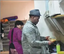  ??  ?? Asare-Yeboah cooks at home.