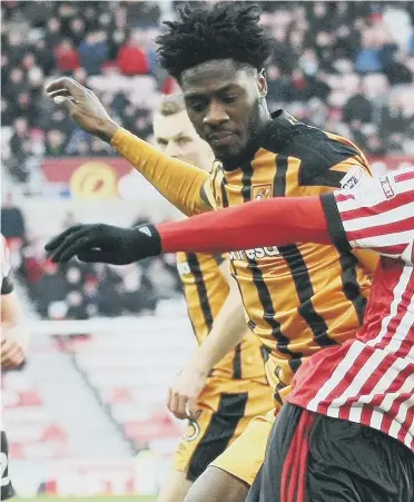  ??  ?? Academy success story Josh Maja, here battling against Hull’s Ola Aina at the Stadium of Light last week, has delighted Sunderland’s hierarchy.