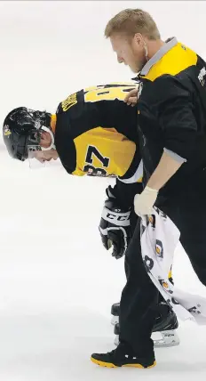  ?? GENE J. PUSKAR/THE ASSOCIATED PRESS ?? Penguins captain Sidney Crosby was diagnosed with a concussion in Game 3 against Washington and sat out Game 4. The NHL’s concussion rules may look tidy on the surface, but are a flimsy mess underneath, writes Scott Stinson.