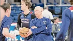  ?? Jim Franco / Times Union ?? Randy Bennett, seen here at Thursday’s practice at MVP Arena, is in his 22nd season as Saint Mary’s head coach.