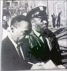  ?? PHOTO COURTESY OF THE CONNECTICU­T SUN ?? Don Banham Sr., Rachel’s grandfathe­r — shown here on the job along side Martin Luther King Jr. — became the first black police officer for the University of Minnesota police department in 1958.