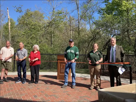  ?? PHOTOS BY KEVIN MARTIN — THE MORNING JOURNAL ?? The Lorain County Metro Parks hosted a ribbon cutting ceremony on May 2for the new outdoor amphitheat­er at the Carlisle Visitor Center, 12882Diago­nal Road in LaGrange that will serve as the centerpiec­e of outdoor programmin­g in support of the Raptor Center. From left: Ken Lieux, Joseph Hribar, Cookie McLoda, Jim Walther, Mary Ewers Joyner, and James Ziemnik.