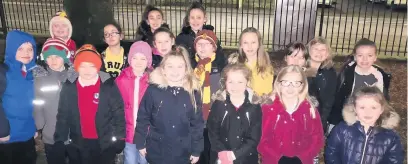  ??  ?? Pupils from Accrington St Mary Magdalen’s CE Primary School who sang Christmas songs at the Milnshaw lights switch-on