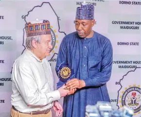  ?? ?? Governor Zulum (right) presenting a souvenir to the UN Secretary General, Antonio Guterres on Tuesday in Maiduguri.
