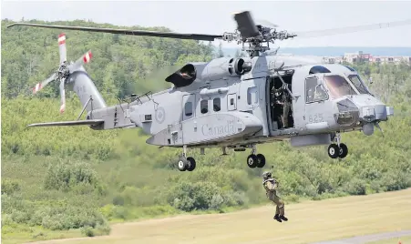  ??  ?? An RCAF CH-148 Cyclone maritime helicopter technician engages in a hoist exercise in Halifax on Friday. The Cyclone will have its first internatio­nal deployment with the frigate HMCS Ville de Québec next week when it joins a NATO mission in the...