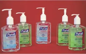  ?? NICHOLAS KAMM/AFP VIA GETTY IMAGES ?? This photo illustrati­on shows bottles of Purell hand sanitizers, which are selling for inflated prices on the internet.