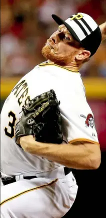  ?? USA Today & Getty Images photos ?? In a matchup perhaps delicious only to Pirates fans, Mark Melancon squared off against former battery mate Russell Martin in the eighth inning Tuesday night in Cincinnati.