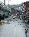  ?? ?? Derrumbe. Un barrio afectado por las lluvias en Caracas.